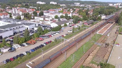 Aerial drone view of freight train and cargo logistics station for global trade Stock Footage 345774132