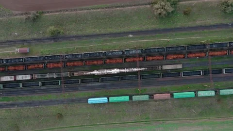An aerial drone view of freight wagons at the station surrounded by fields Stock Footage 145649154