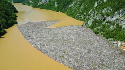 Aerial drone view of the garbage floating on the Drina river Stock Footage 264767319