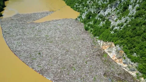 Aerial drone view of the garbage floating on the Drina river Stock Footage 264858263