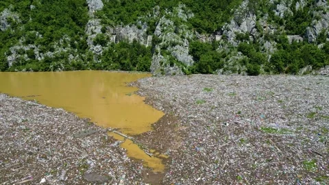 Aerial drone view of the garbage floating on the Drina river Stock Footage 264858824