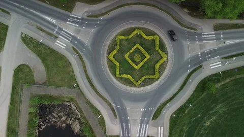 Aerial drone view of a geometric traffic roundabout – 4K ProRes Stock Footage 334458613