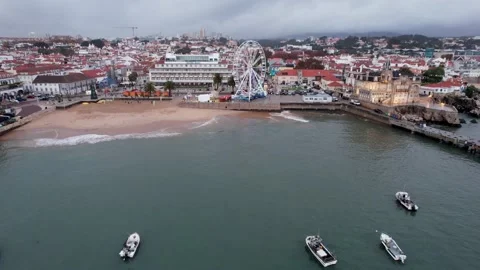 Aerial drone view of giant Ferris wheel has been setup at Cascais Beach Stock Footage 223207957