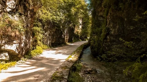 Aerial drone view going between gorge mountain road Stock Footage 97064388