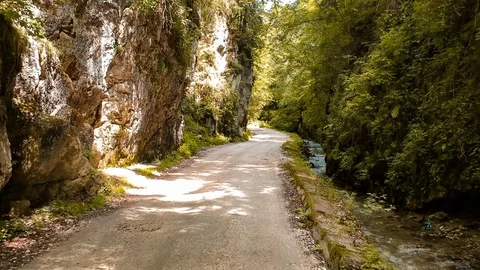 Aerial drone view going between gorge mountain road Video stock 97064442