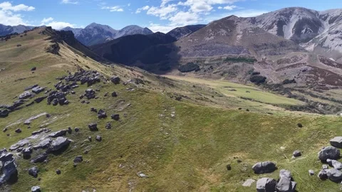 Aerial Drone View of Grassy Mountain Ridge with Rocks and Scenic Valley Video stock 337787874