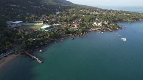 Aerial Drone View of Green Forest and Turquoise Sea in Ilhabela, Brazil Stock Footage 321775831