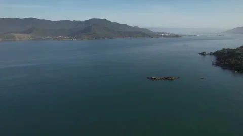 Aerial Drone View of Green Forest and Turquoise Sea in Ilhabela, Brazil Stock Footage 321775911