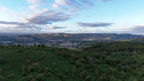 Aerial Drone View of Green Forest and Caerphilly Mountain Landscape Stock Footage 343577543