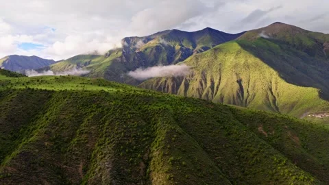 Aerial Drone View of Green Mountain Valleys and Clouds in Western Sichuan China Stock Footage 337455510