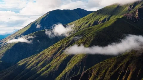 Aerial Drone View of Green Mountain Ridge and Clouds in Western Sichuan China Stock Footage 338428828