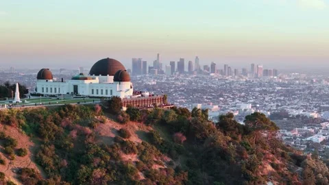 Aerial drone view of Griffith Park, Observatory. sunset downtown Los Angeles  動画素材 265106844