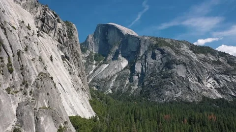 Aerial Drone View of Half Dome Granite Peak and Forest in Yosemite National Park Stock Footage 319077516