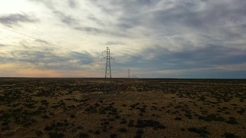 Aerial drone view of high voltage electricity and power lines at the sunset Stock Footage 105877611