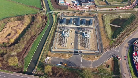 Aerial Drone View of High Voltage Power Transformer at Electrical Substation Stock Footage 330130173