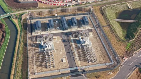Aerial Drone View of High Voltage Power Transformer at Electrical Substation Stock Footage 330133800