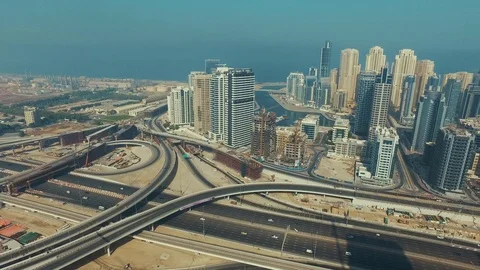 Aerial drone view of Highway car traffic interchange near Dubai Marina Video stock 100856503