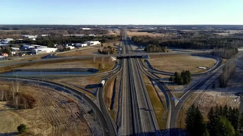 Aerial drone view of highway interchange with industrial area Stock Footage 332012913