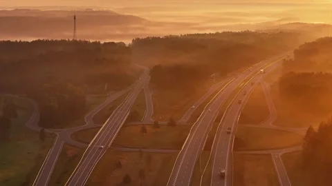 Aerial Drone View of Highway Interchange in Golden Sunrise Light Video stock 344598126