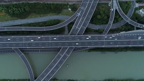 Aerial drone view of highway multi-level junction road with moving cars at Stock Footage 111229134