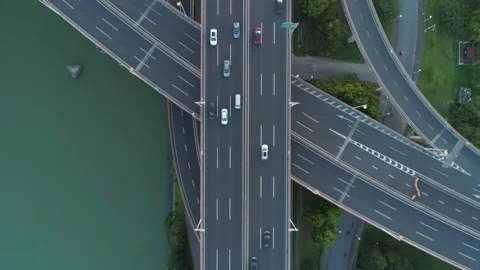 Aerial drone view of highway multi-level junction road with moving car at sunset Stock-Footage 136863541