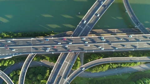 Aerial drone view of highway multi-level junction road with moving car at sunset Vidéo 144920930