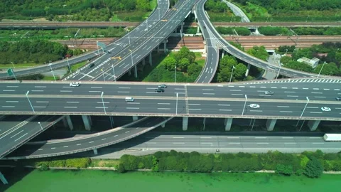 Aerial drone view of highway multi-level junction road with moving cars at Stock Footage 152876782