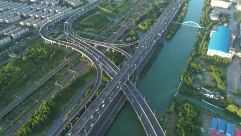 Aerial drone view of highway multi-level junction road with moving cars. Active Stock Footage 152973408
