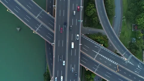 Aerial drone view of highway multi-level junction road with moving cars at Stock Footage 152974254