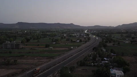 Aerial Drone View of Highway Through Rural Landscape at Dusk Stock Footage 334913163