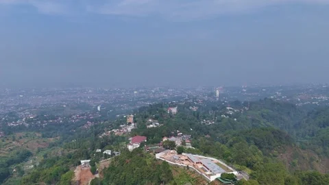 Aerial Drone View of Hills, Forest and Cliffside Buildings in Dago Pakar Bandung 库存影片 342418513