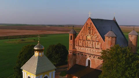 Aerial drone view of historic brick church and orthodox chapel in Belarus Stock Footage 334130631