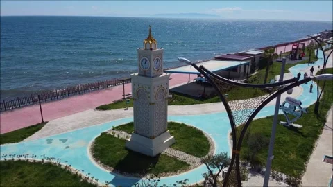 Aerial Drone View of Historic Clock Tower on Sunny Seaside Plaza. Stock Footage 320848152