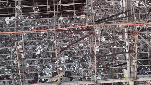Aerial drone view of house with broken rooftop debris and framework 動画素材 333040036