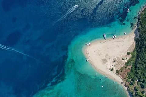 Aerial drone view of iconic small uninhabited island of Marathonisi featuring Stock Photos