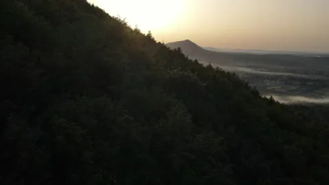 Aerial drone view of idyllic rolling hills landscape in Carpathians with houses Stock Footage 280193248