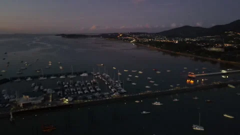 Aerial drone view of illuminated Chalong Pier at dawn in Phuket 스톡 동영상 263392553