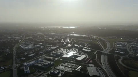 Aerial drone view of industrial zone and highway interchange at sunset near Stock Footage 328523713