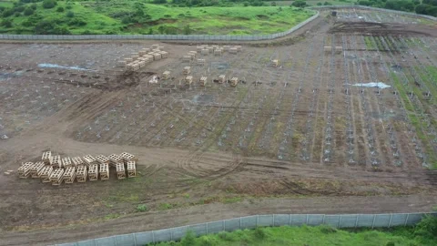Aerial drone view of Installing a Large Solar Array in solar farm. Stock Footage 314771206
