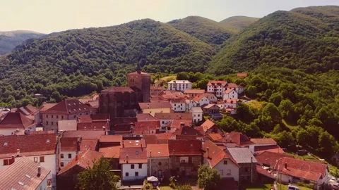 Aerial Drone View of Isaba, Spain, San Cipriano Church, Stone Houses, Pyrenees Stock Footage 300805934