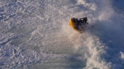 Aerial drone view of jet ski action with surfers being carried in Nazare Stock Footage 295851777