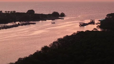 Aerial drone view of Kampung Kuala Muda fishing boats at sunset Video stock 337548618