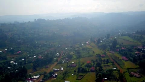 Aerial drone view of Kapchorwa town and hills in Eastern Uganda under hazy Stock Footage 312316933