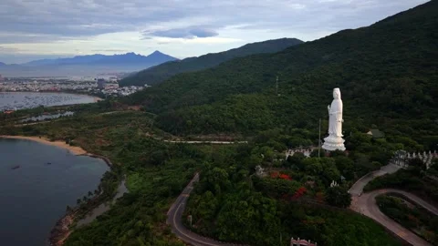 Aerial drone view of Lady Buddha overlooking Da Nang coastline Vietnam Stock Footage 340597517