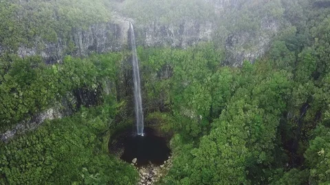 Aerial drone view of "Lagoa do Vento" waterfall in "Paul da Serra", Madeira Stock Footage 122819632