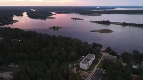 Aerial drone view of Lake Seliger with residential buildings at sunset Stock Footage 338095827