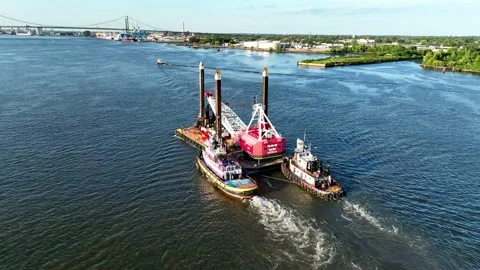 Aerial Drone View of a Large Barge being pushed by Two Pusher Tug Boats Stock Footage 204503629