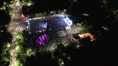 Aerial Drone View of a Large Crowd Dancing at an Outdoor Night Music Festival Stock Footage 340275208