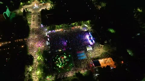 Aerial Drone View of a Large Crowd Dancing at an Outdoor Night Music Festival Stock Footage 340275220