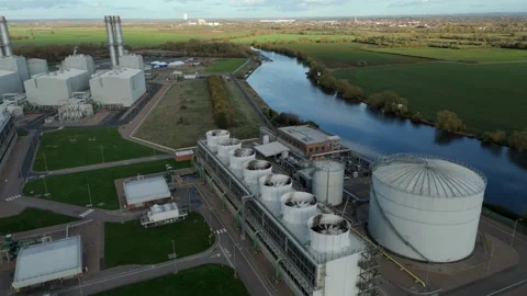 Aerial drone view of large gas powered power plant with chimney stacks and Stock Footage 327429231